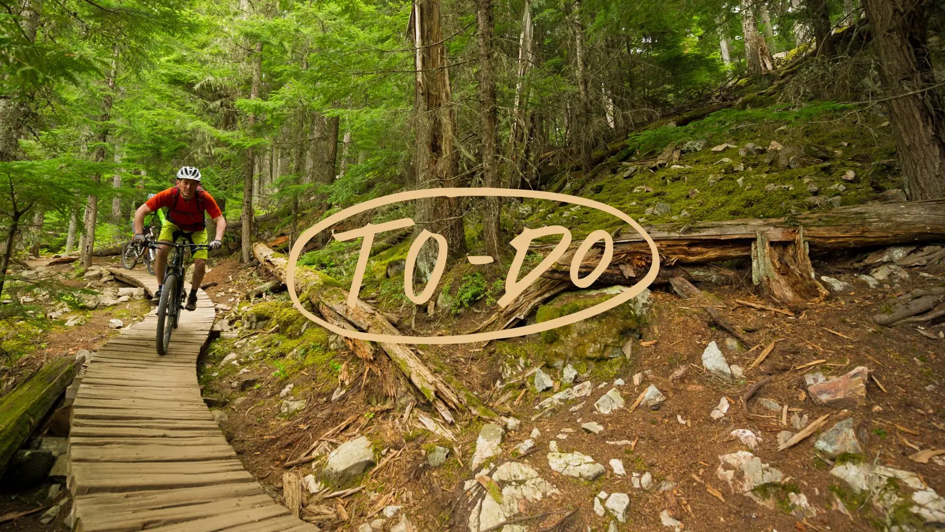 A mountain biker with a hand written note saying to-do to represent things to do in Whistler.