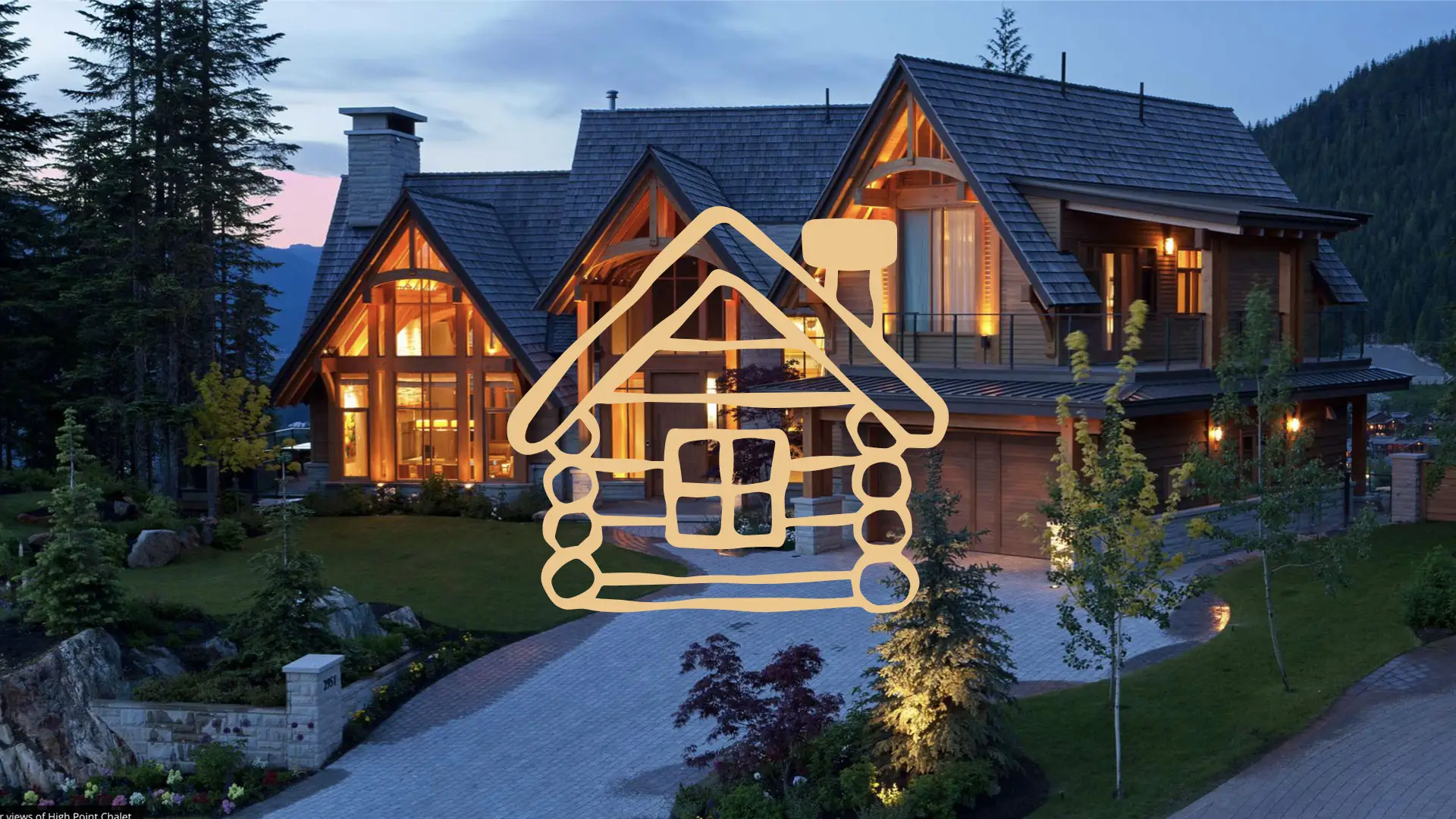 A luxury Whistler property lit up at night, surrounded by nature